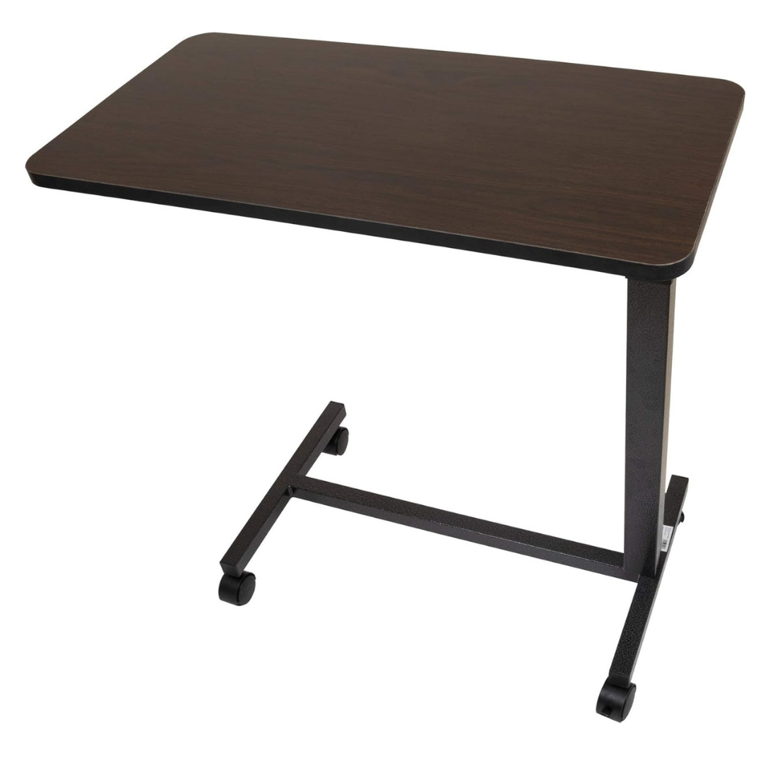 The Roscoe Rolling Overbed Table is a small, rectangular, dark wood non-tilting bedside table with black metal legs on wheels, designed for use as an overbed or laptop desk. It is shown against a white background.